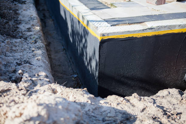 Professional Waterproofing technician working in Trufant, MI